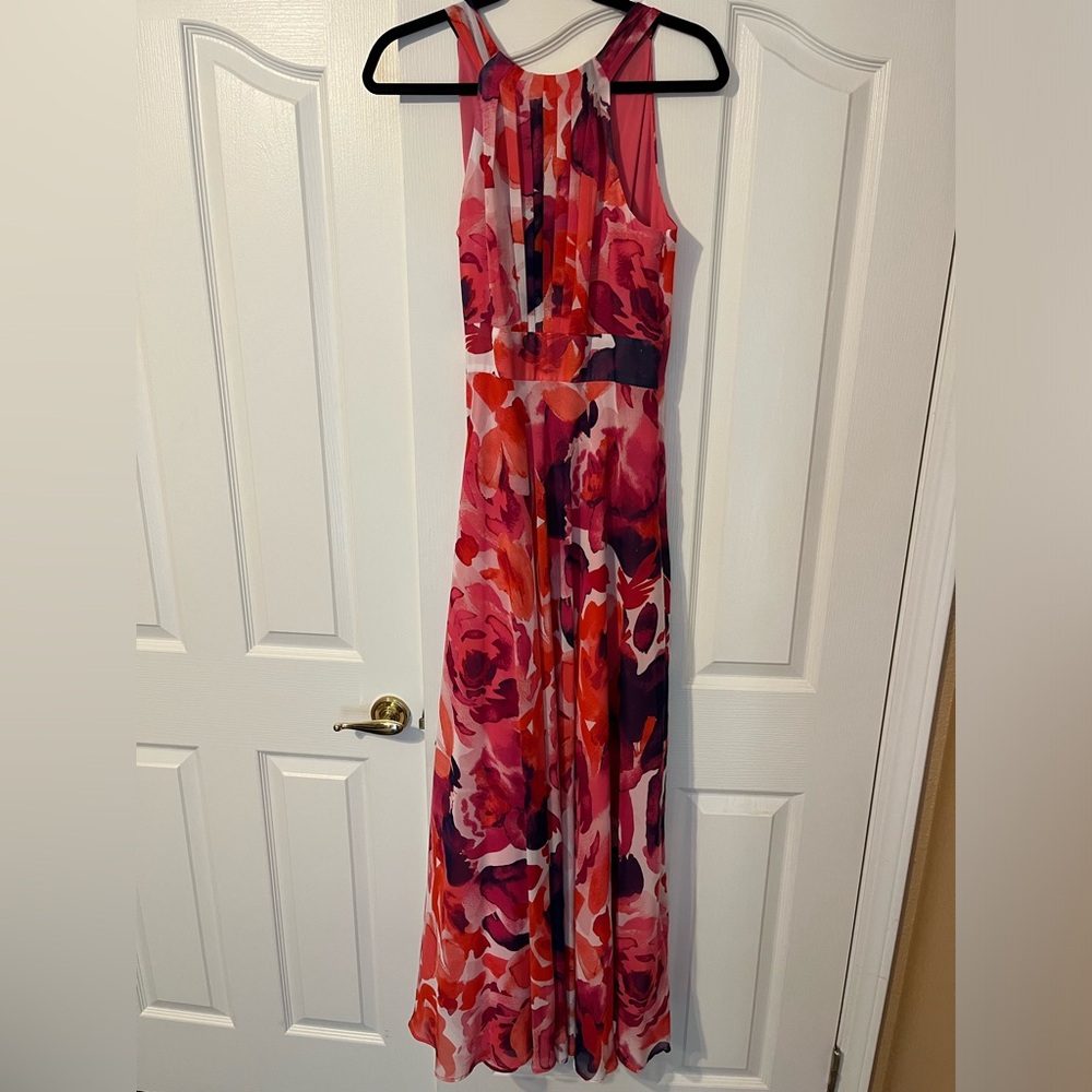 Eliza J. Halter neck floor length gown. Size 8. Fuscia floral pattern.